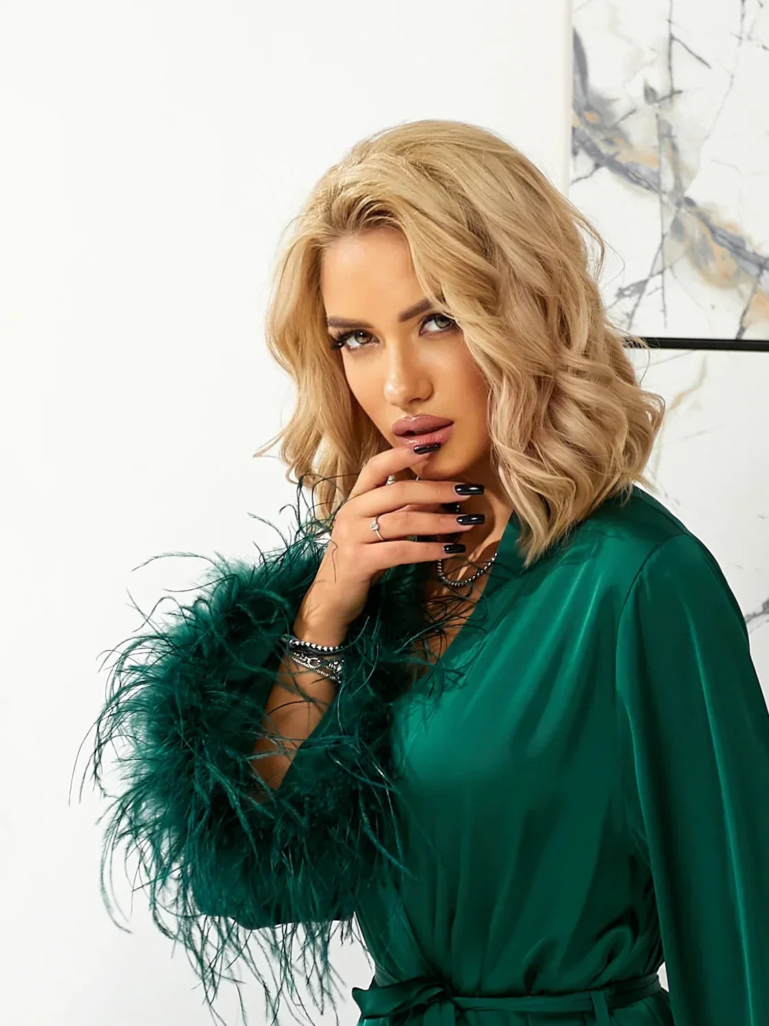 Emerald green silk bridal robe with feather trim, perfect for wedding morning