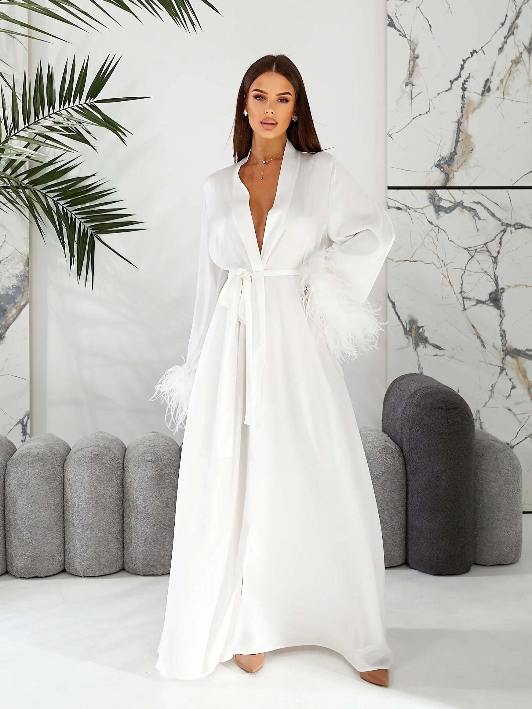White silk bridal robe with feathered cuffs, perfect for wedding morning elegance.
