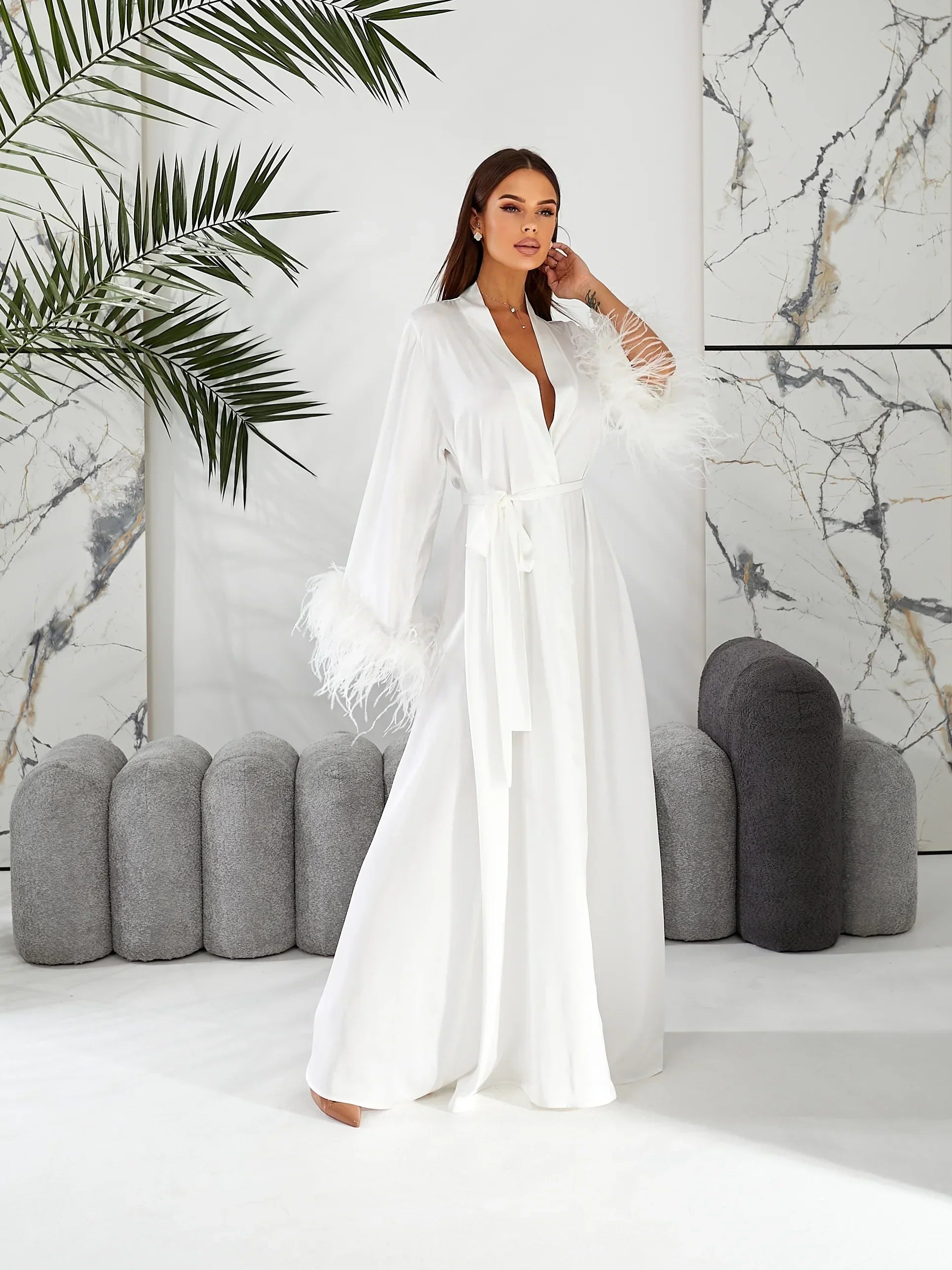 White silk bridal robe with feather trim, perfect for wedding morning, modern setting