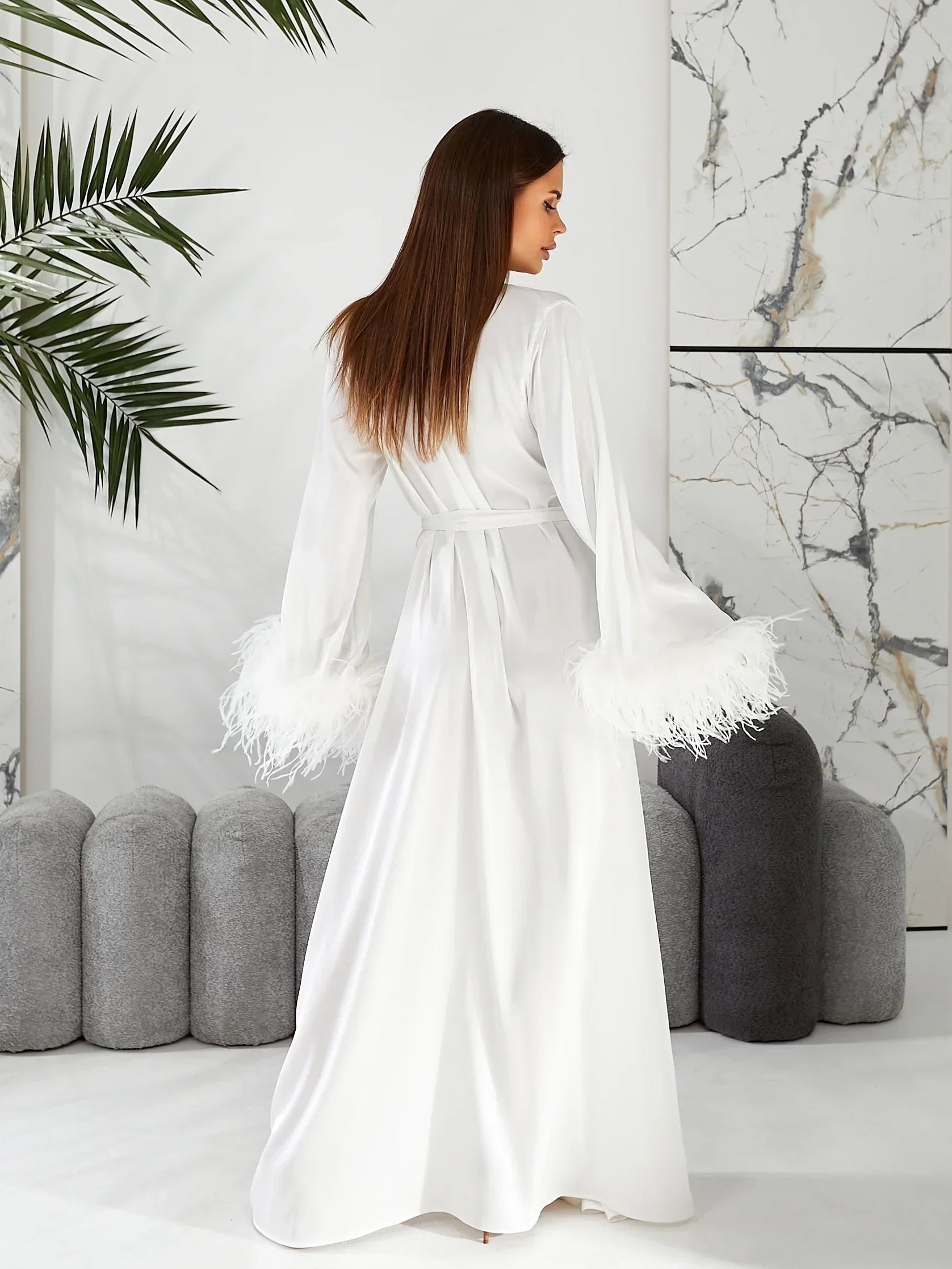 White silk bridal robe with feather trim sleeves, perfect for wedding morning elegance.