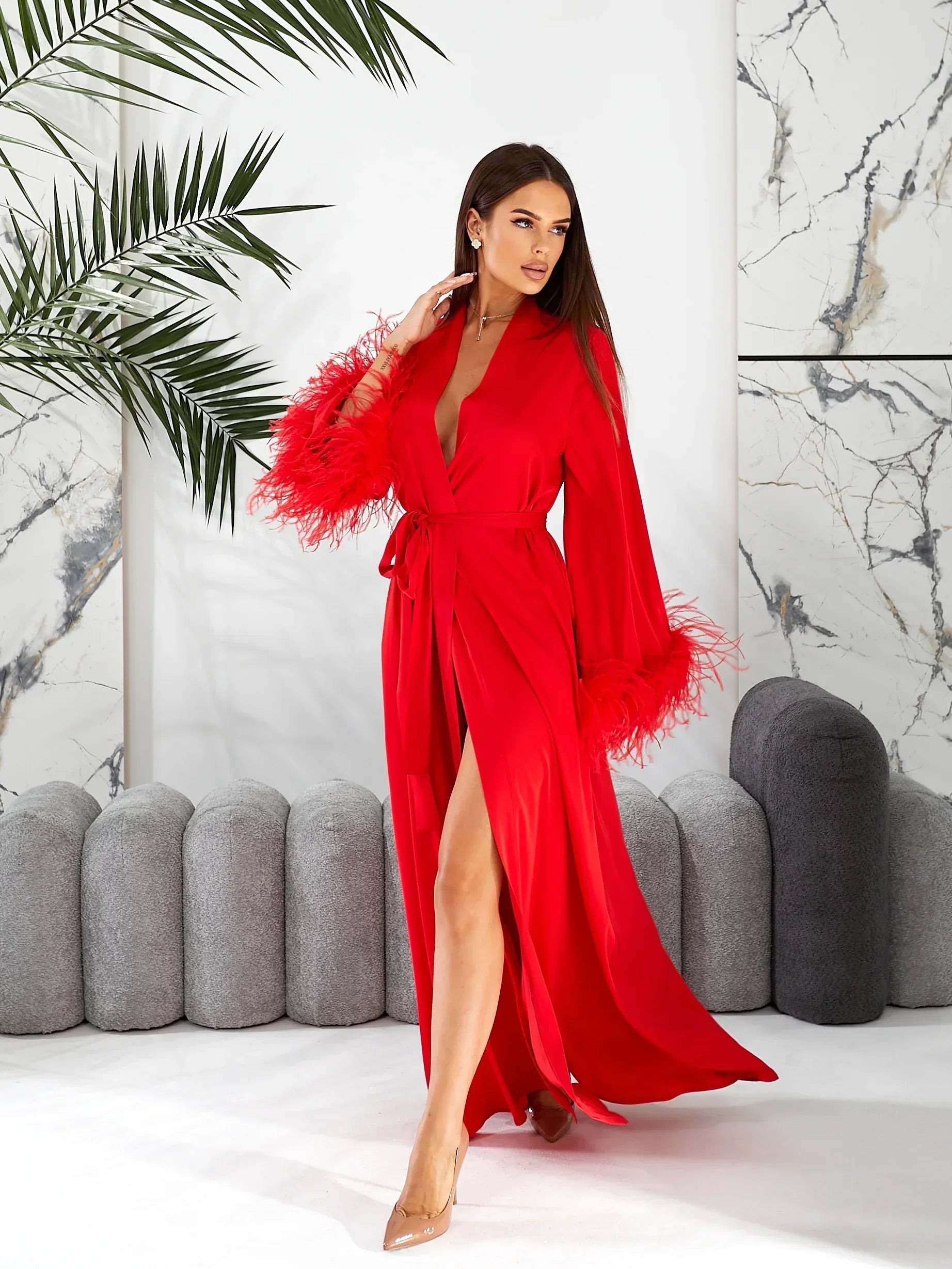 Red silk bridal robe with feather trim, elegant design for wedding morning photos