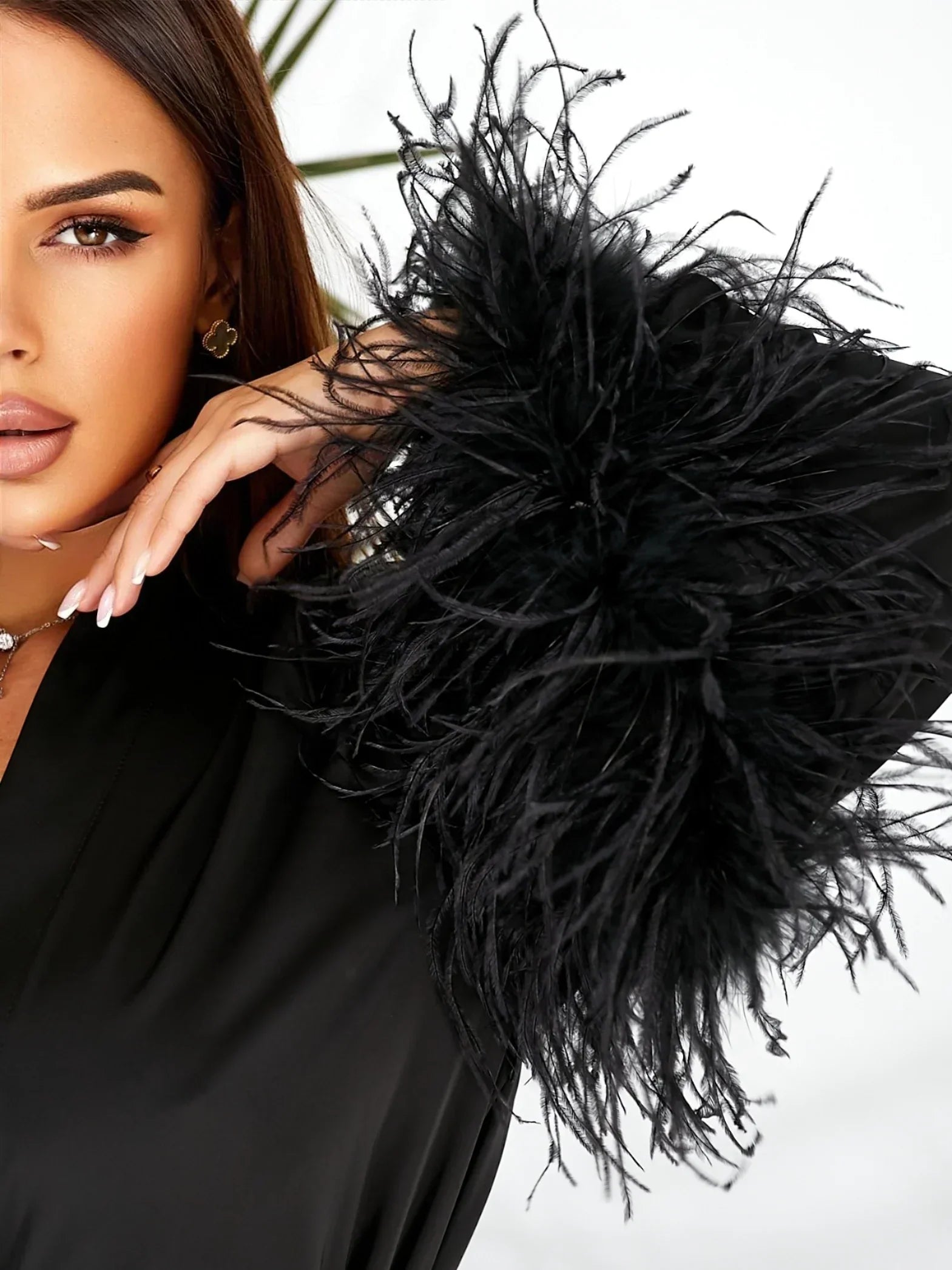 Black silk bridal robe with dramatic feather sleeves, perfect for wedding morning elegance