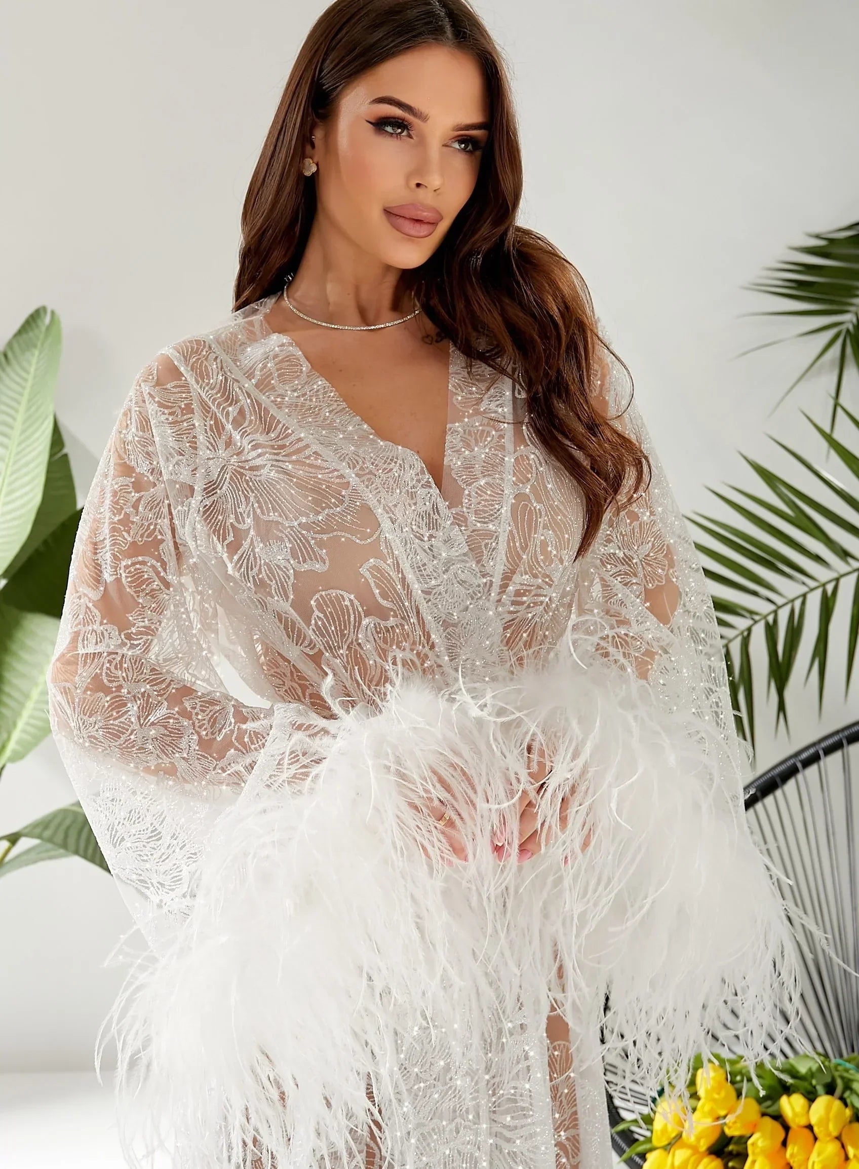 Sheer white lace bridal robe with feather cuffs, ideal for wedding morning photos