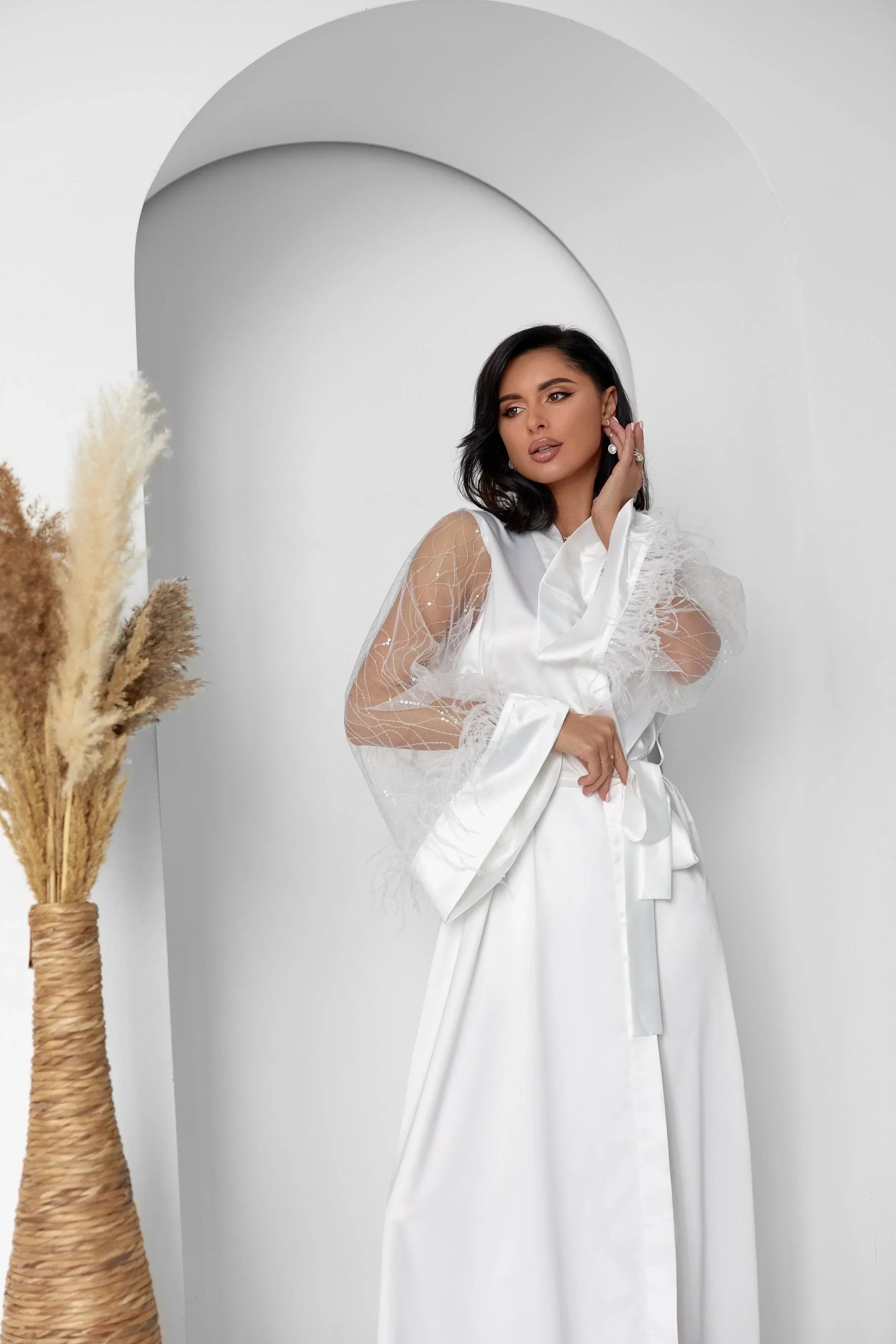 White silk bridal robe with sheer lace feather sleeves, perfect for wedding morning