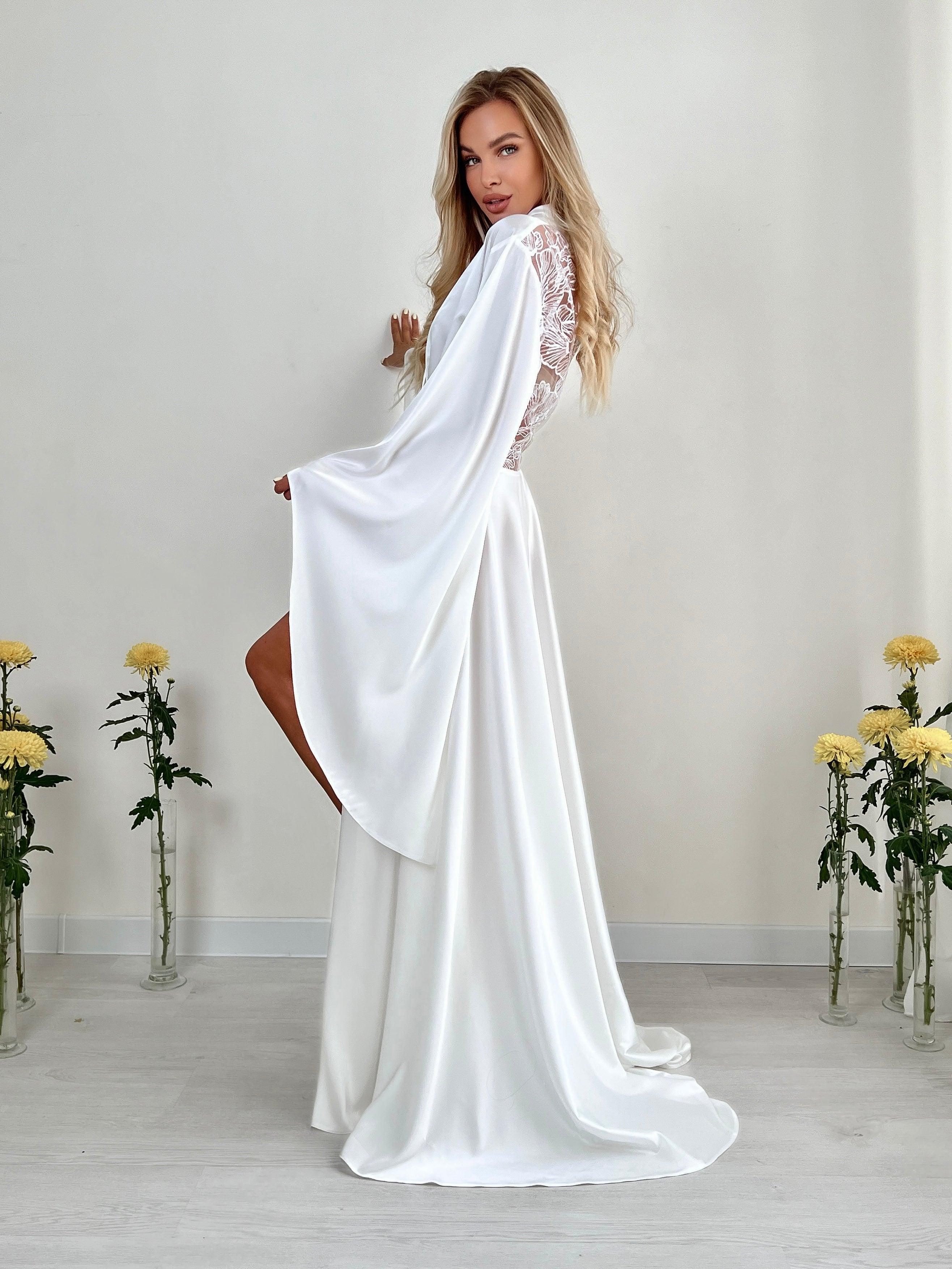 White silk bridal robe with sheer lace sleeves, perfect for wedding morning elegance.