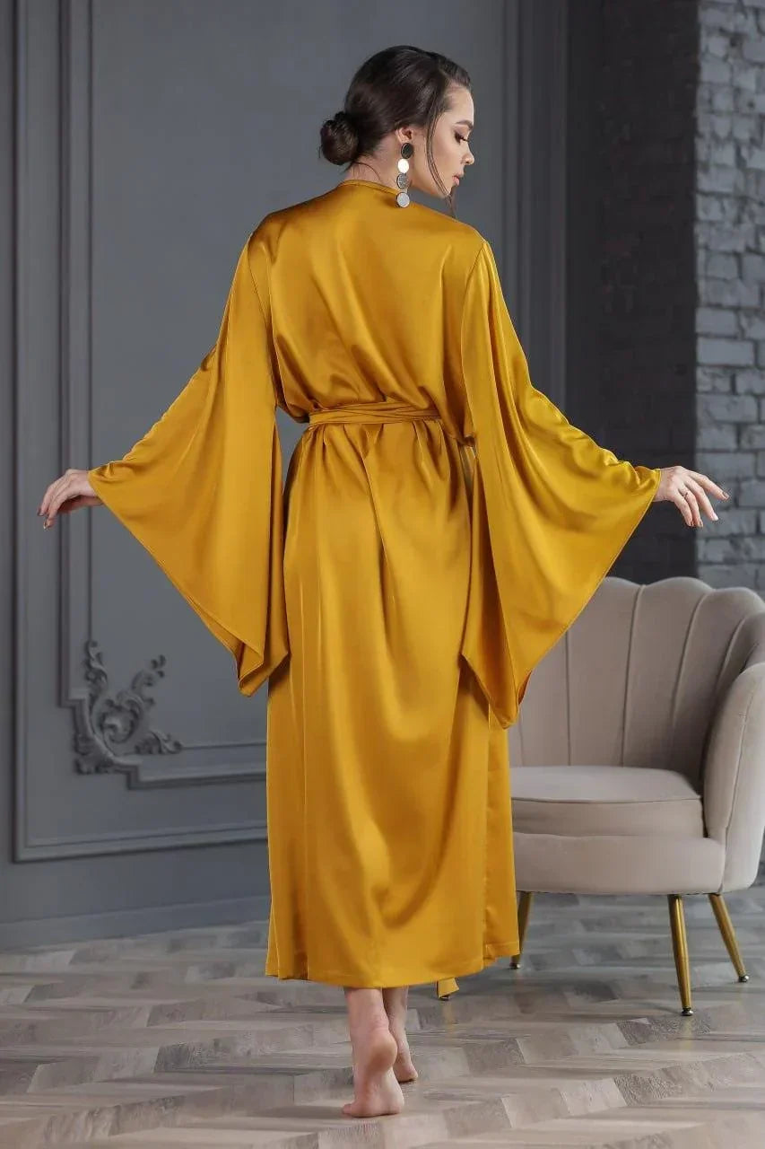 Mustard yellow silk bridal robe with wide sleeves, perfect for wedding morning preparation.