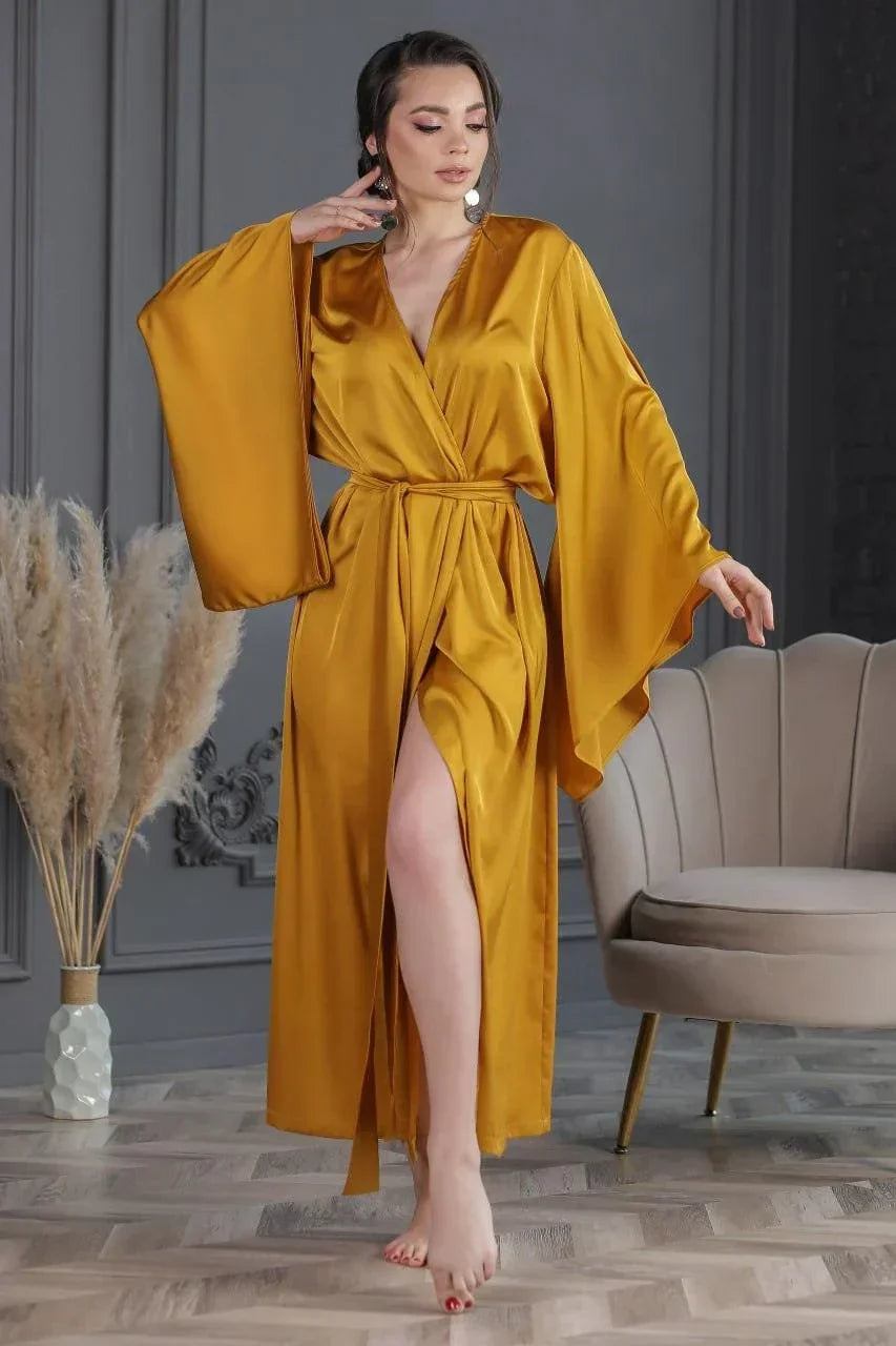 Bridal robe in gold silk with kimono sleeves, perfect for wedding morning or bridal getting ready.