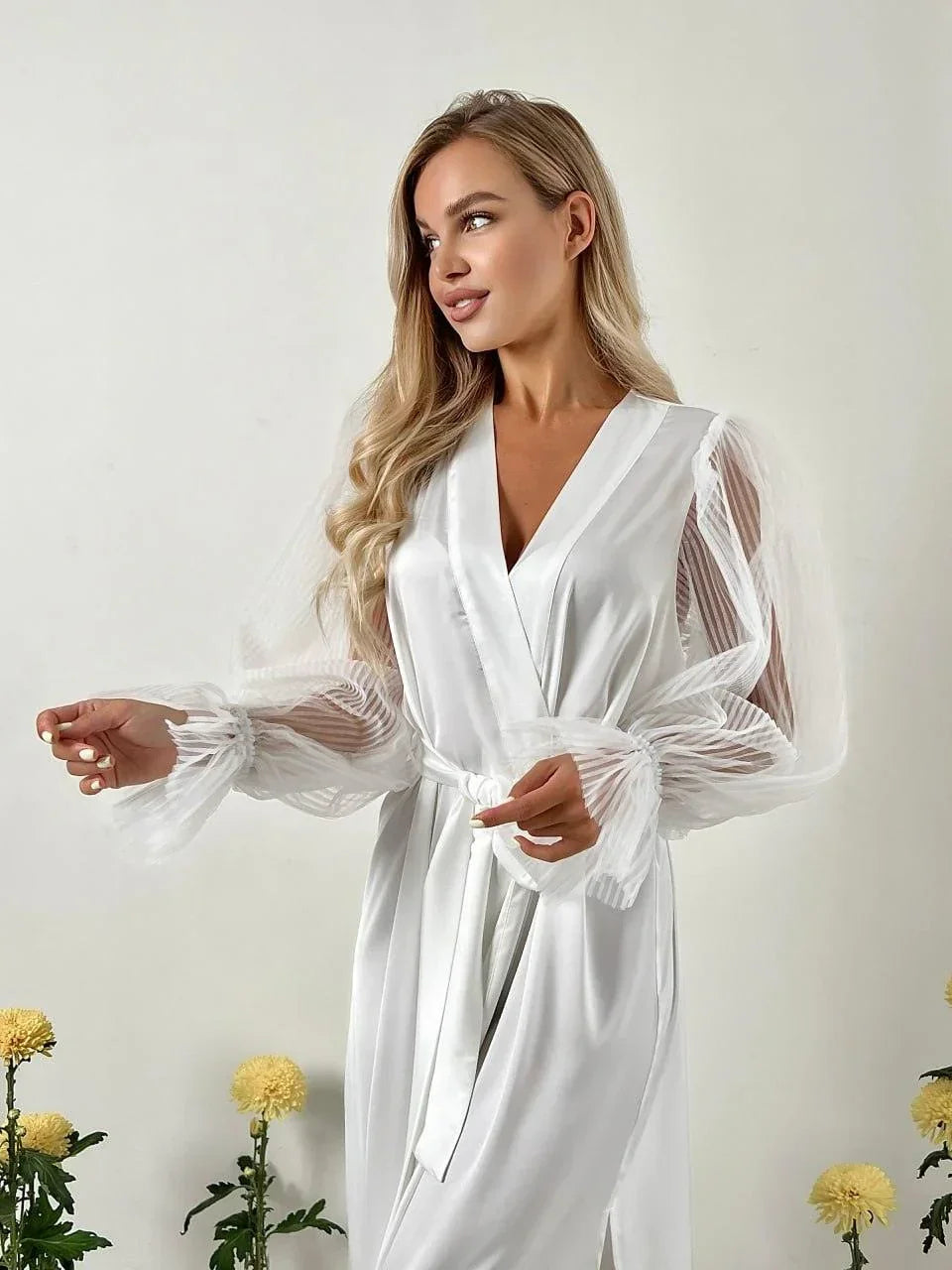 White silk bridal robe with sheer lace sleeves, perfect for wedding morning photos