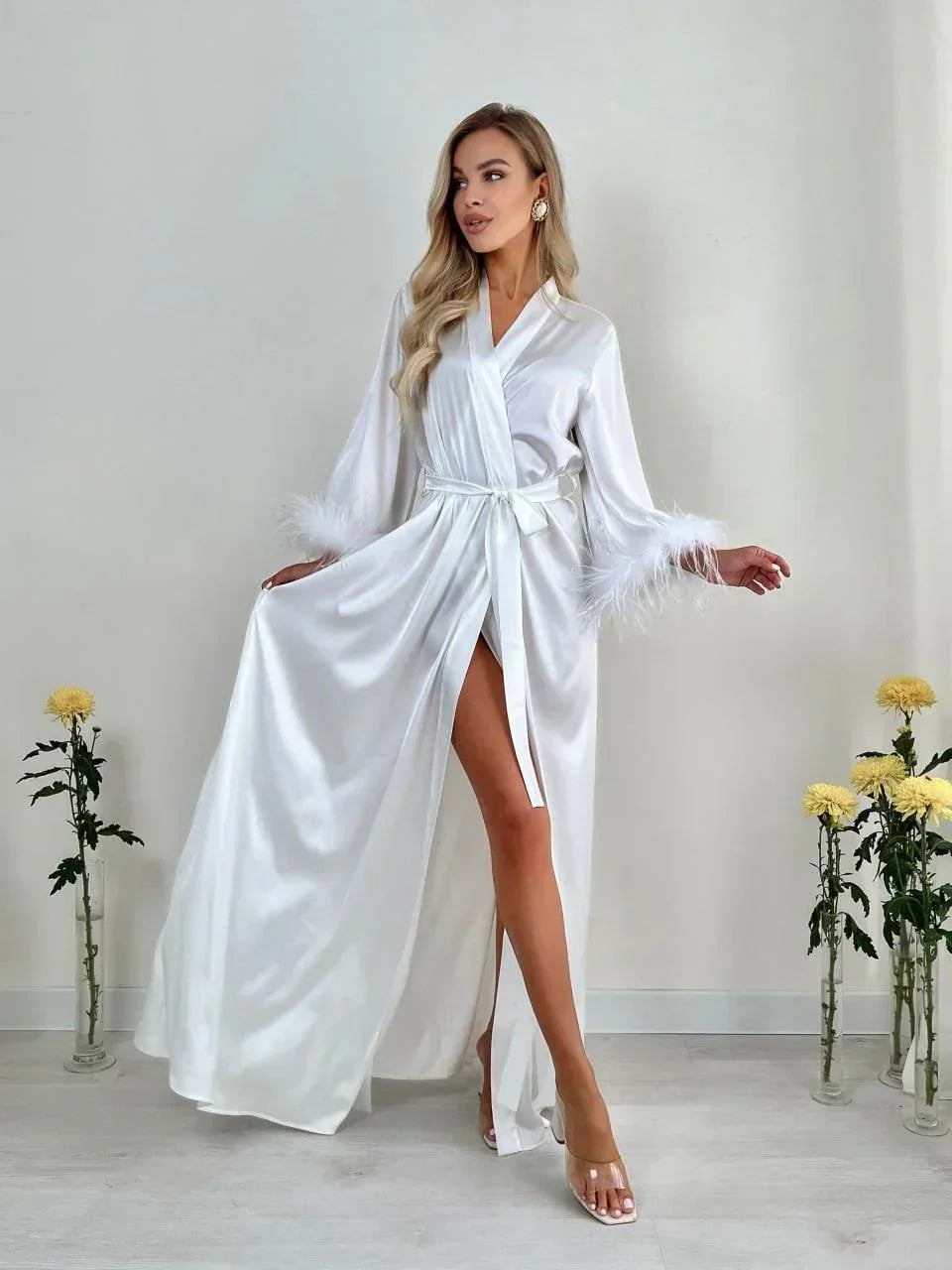White silk bridal robe with feather trim, perfect for wedding morning or bride photos.