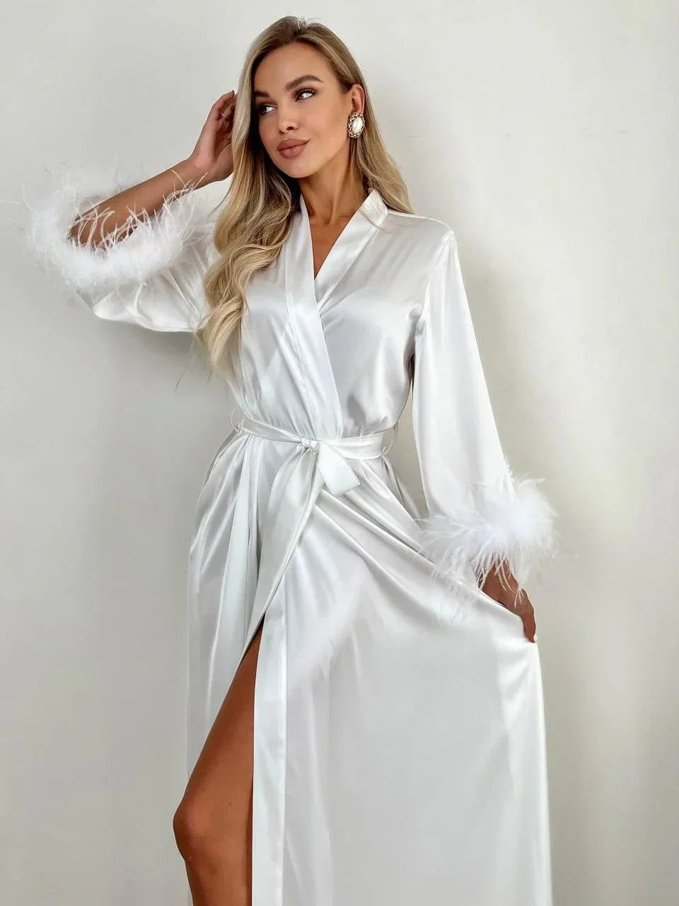 White silk bridal robe with feathered cuffs, perfect for wedding morning elegance.
