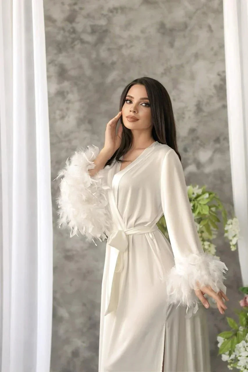 White silk bridal robe with feathered sleeves, perfect for wedding morning elegance