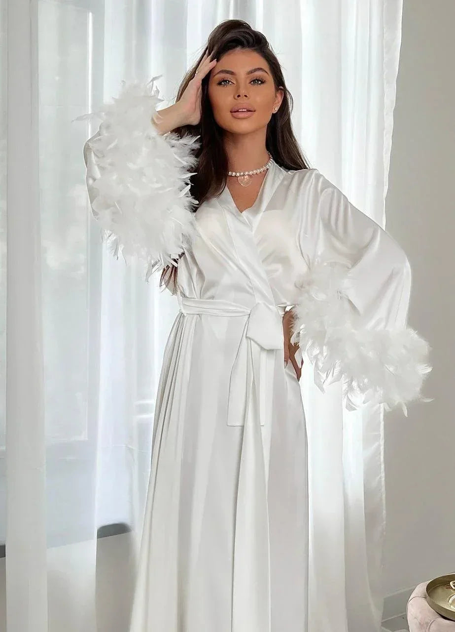 White silk bridal robe with feathered sleeves, perfect for wedding morning elegance