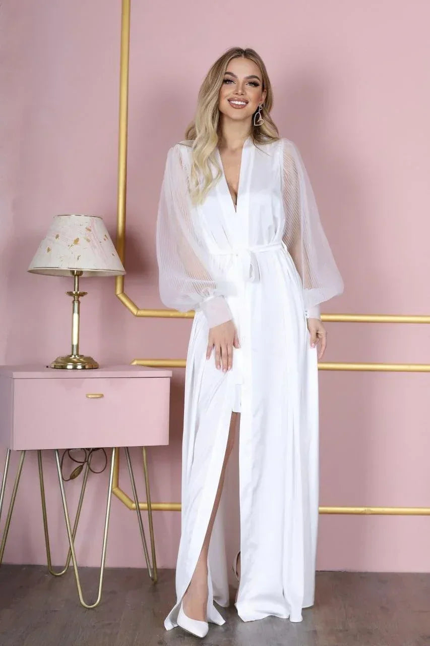White silk bridal robe with sheer lace sleeves, perfect for wedding morning photos.