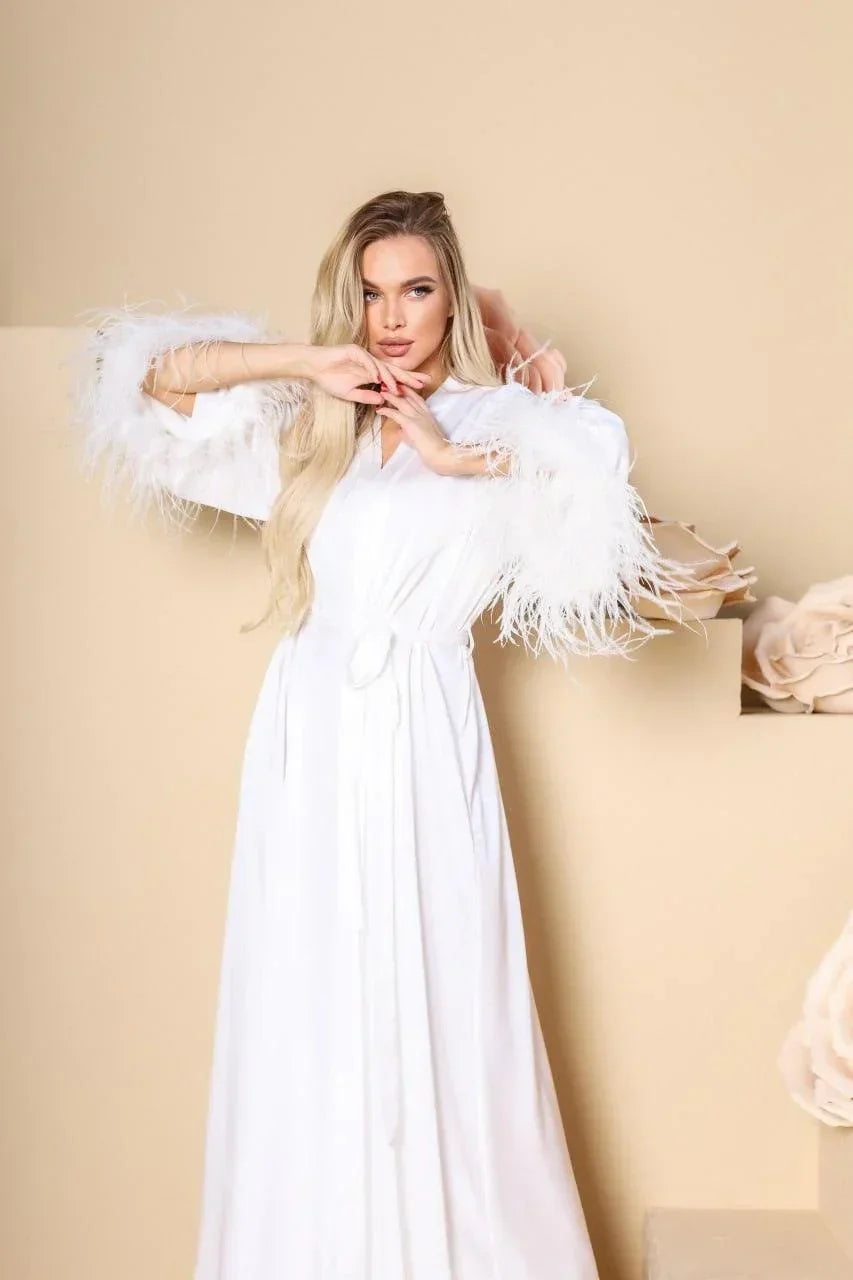 White silk bridal robe with feather sleeves, perfect for wedding morning, elegant setting